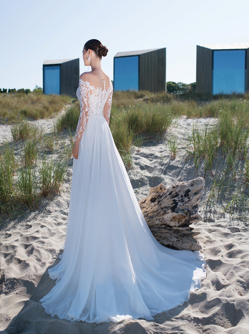 Robe de mariée trapèze à manches longues en dentelle transparente et à épaules dénudées avec fente