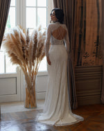 Glittering Long-Sleeve Mermaid Wedding Dress with Beaded Details and Open Back