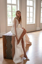 Vestido de novia estilo sirena con mangas largas y lentejuelas