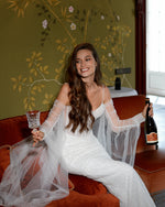 Starlit Grace Mermaid Wedding Gown with Removable Sleeve Cape