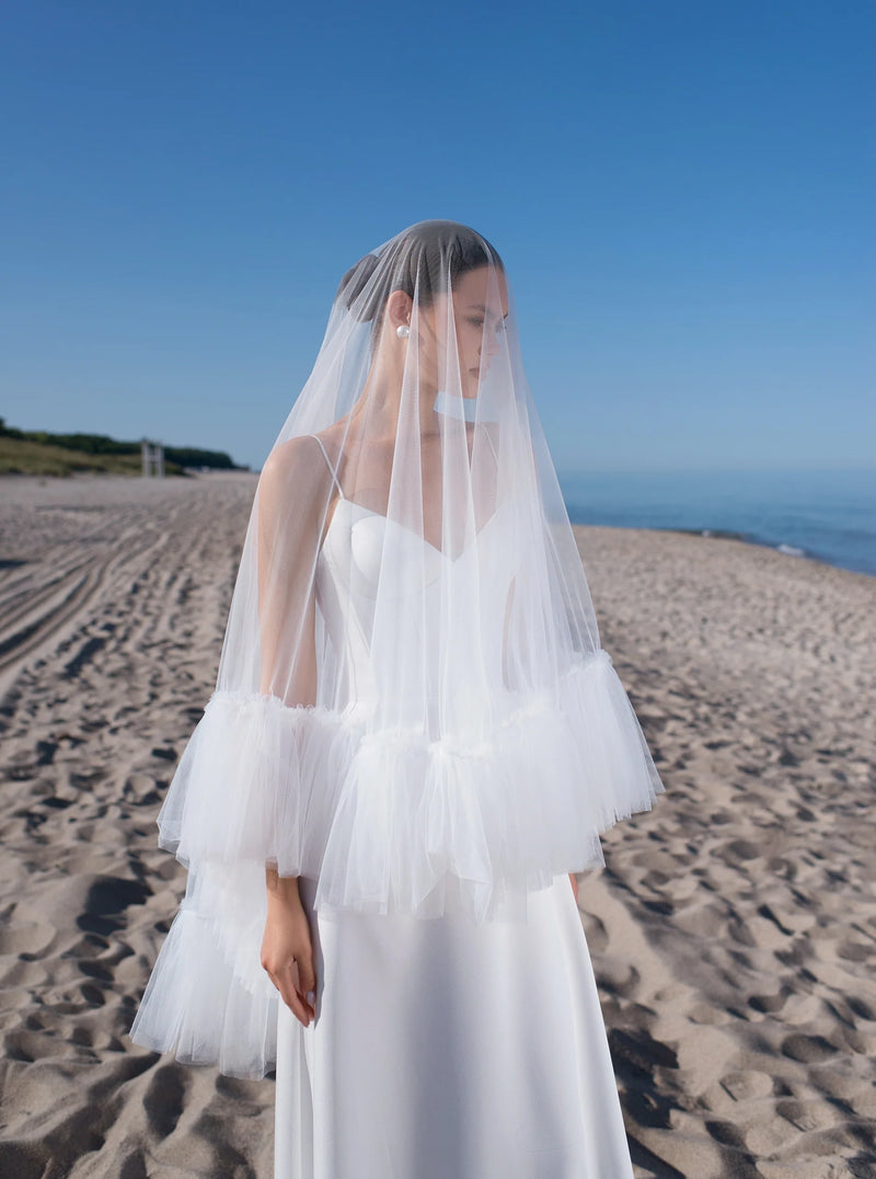 short dress with veil It's true what they say... opposites attract! Strut down the aisle in a short dress, long veil duo for a modern & chic look that will leave your guests in awe. Tap