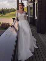 Robe de mariée en dentelle et tulle à pois à manches longues