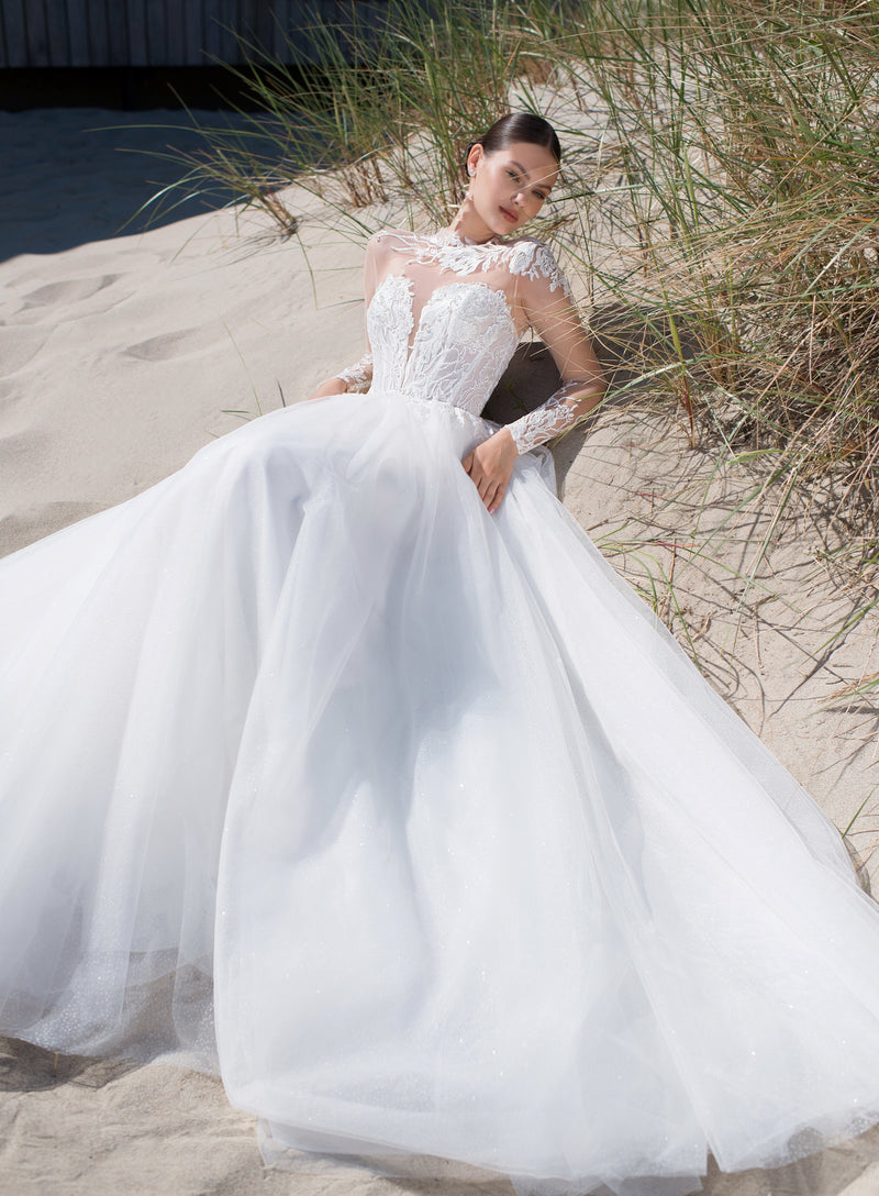 Vestido de novia evasé de manga larga transparente con un impresionante top de encaje