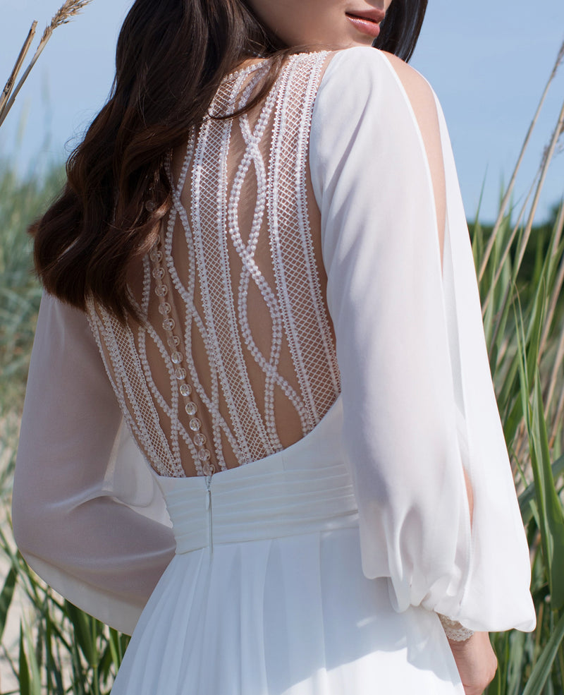 Long Sleeve Wedding Dress with a Front Slit and Back Details