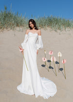 Vestido de novia minimalista sin tirantes con mangas extraíbles