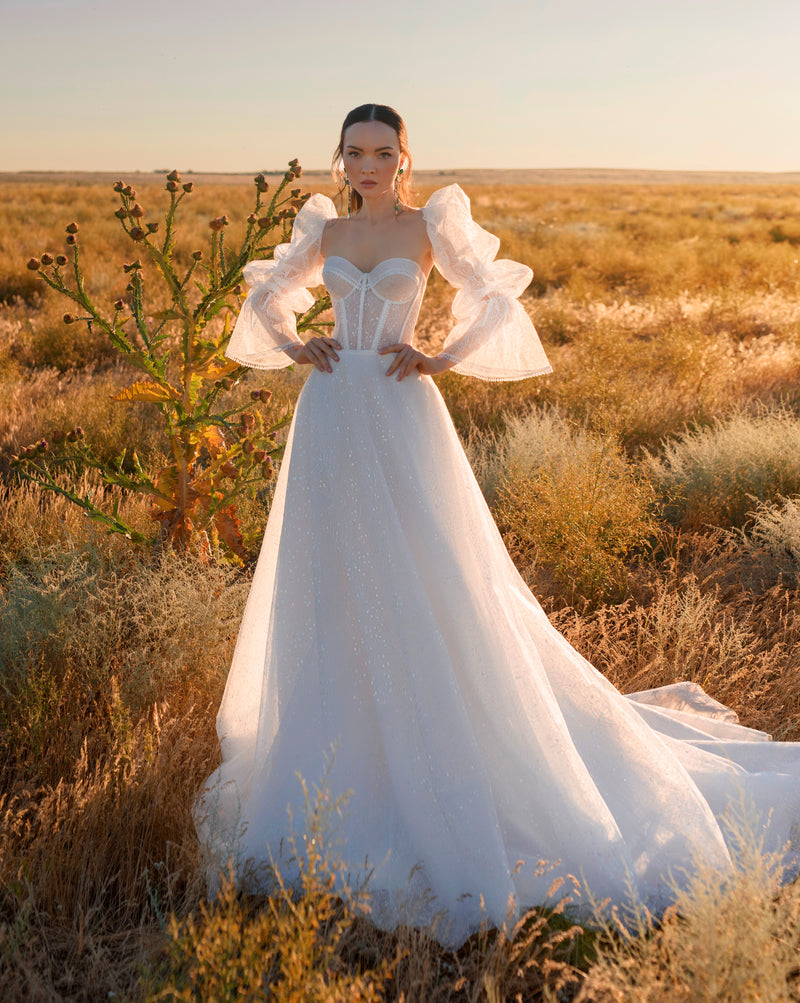 Robe de mariée corset avec boléro à manches longues