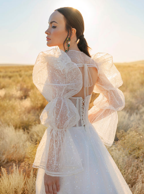 Vestido de novia corsé con bolero de manga larga