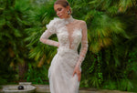 Superbe robe de mariée fourreau à manches longues et transparentes