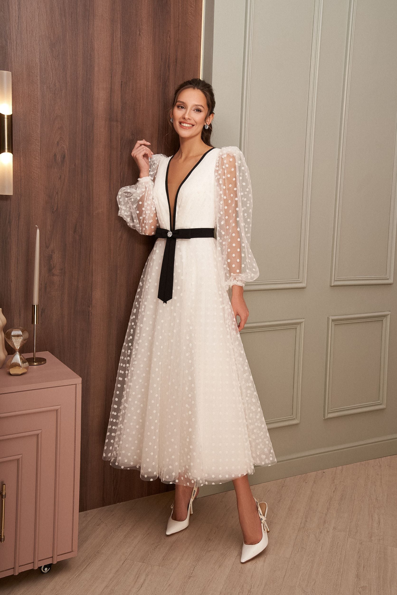 polka dot tulle dress Sweet Romance Tiered Midi in Light Blue Tiered tulle fabric with mini polka dot design throughout Adjustable shoulder ties Fitted through waist with relaxed skirt Smocked back panel Unpadded underwire cups Pull Polka-dot Tulle Flower Girl Dresses