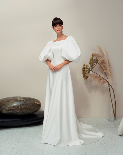 Elegante vestido de novia minimalista de corte A con mangas abullonadas