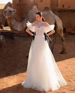 Angelic Beauty: Strapless Wedding Gown with Removable Puff Sleeves