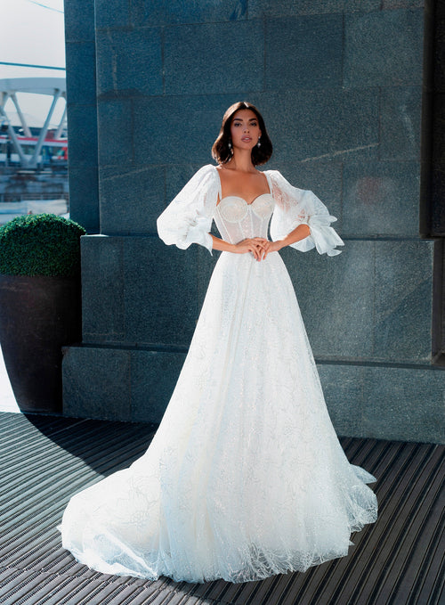 Vestido de novia con corsé brillante y mangas removibles