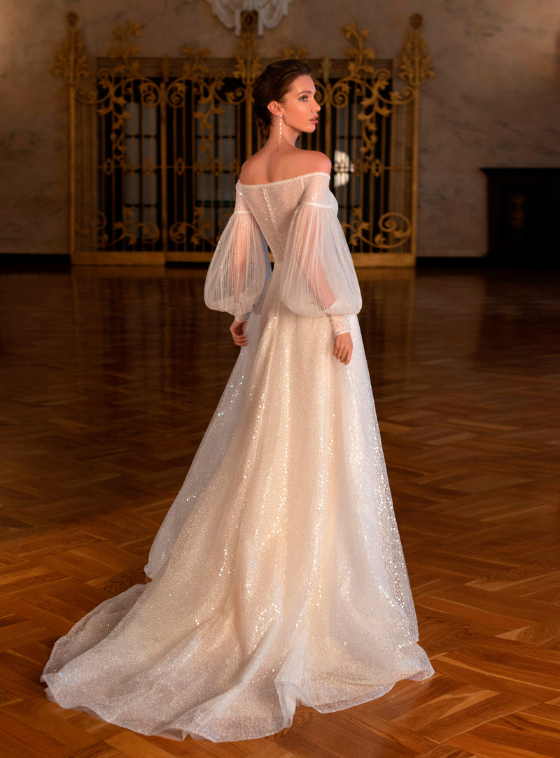 Robe de mariée pailletée à manches bouffantes