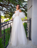 Robe de mariée à manches bouffantes 