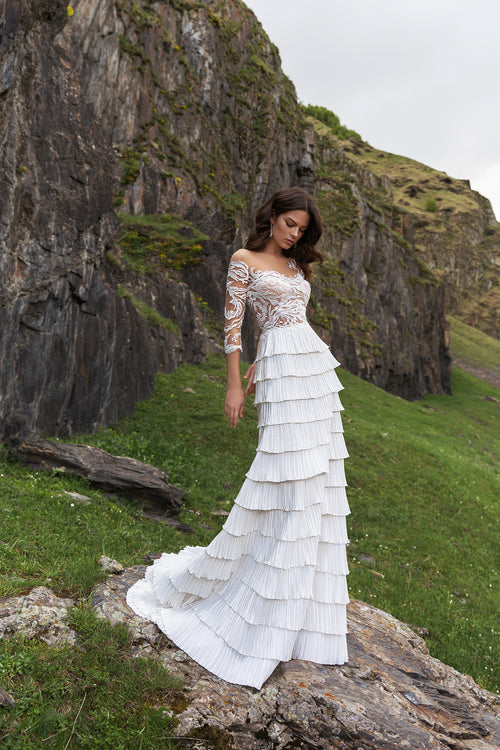 Robe de mariée avec jupe à volants et manches longues